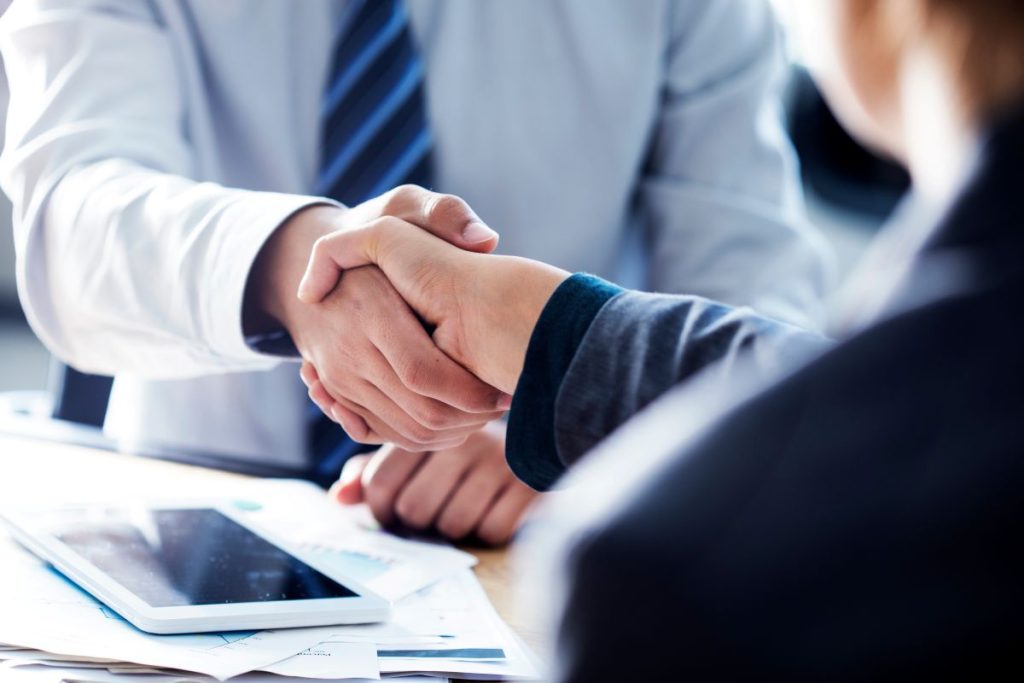 Business handshake in the office, Wayzata