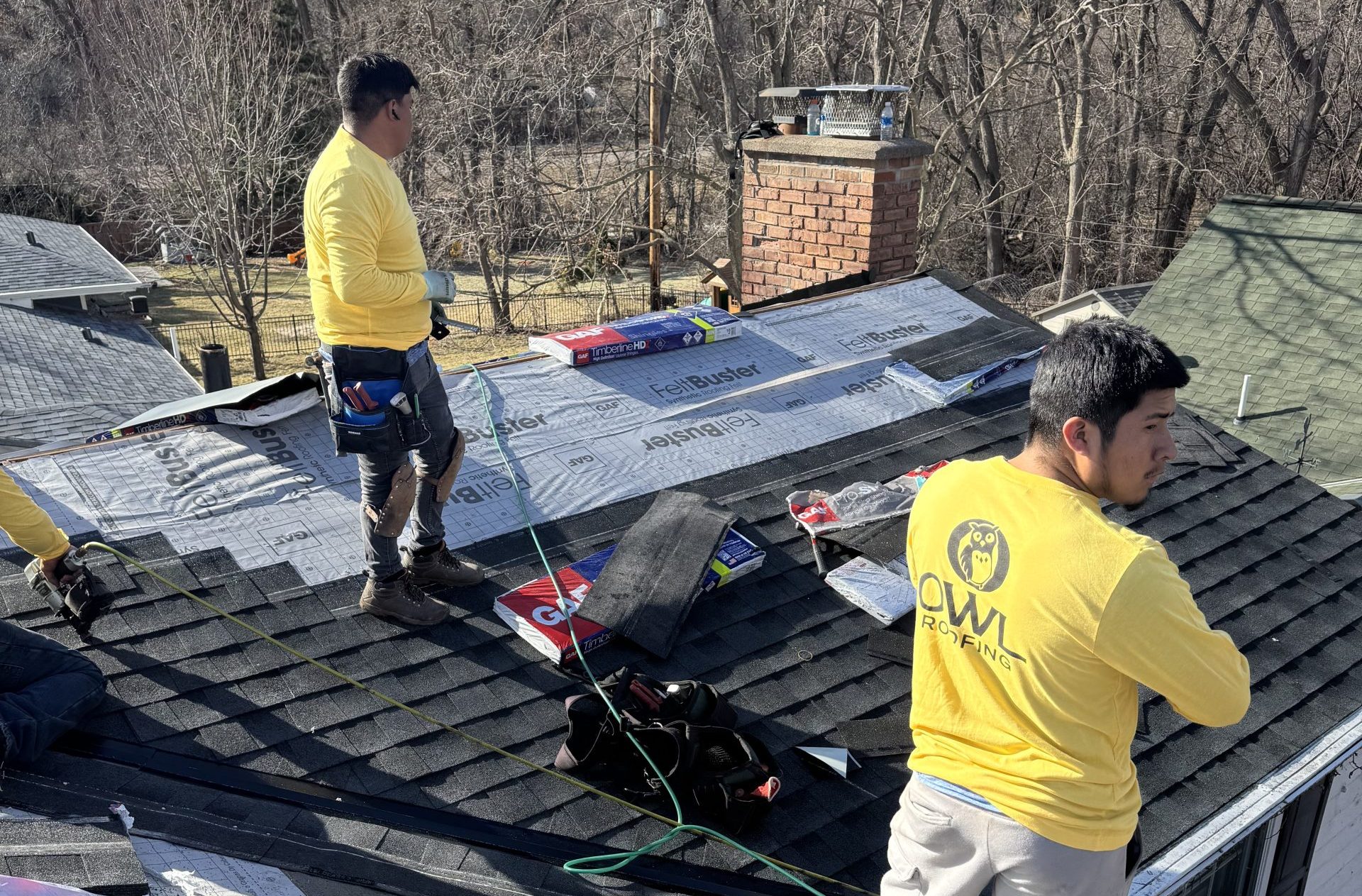 Owl Roofing working on a roof in Wayzata, MN