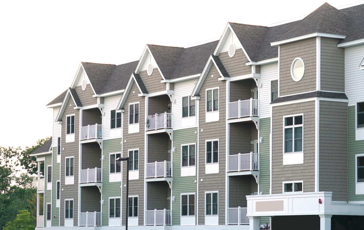 apartment complex with grey shingle roof in Wayzata